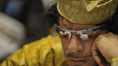 1280px-Muammar_al-Gaddafi,_12th_AU_Summit,_090202-N-0506A-324.jpg