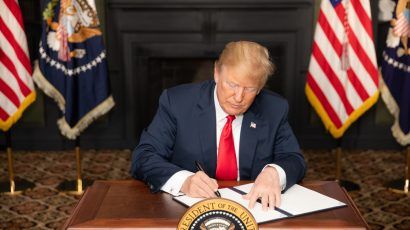 President Trump signs an Executive Order on Iran sanctions on August 5, 2018.