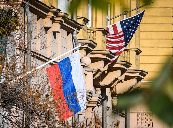 A Russian flag flies next to the US embassy building in Moscow on October 22, 2018.