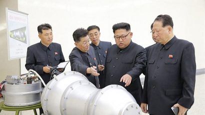 Scientists briefing North Korean leader Kim Jong-un in a photo released in 2017 Credit: Korean Central News Agency.