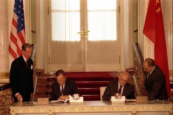 George H.W. Bush and Mikhail Gorbachev sign the Strategic Arms Reduction Treaty (START) in 1991.
