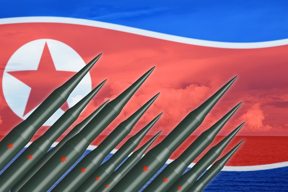 missiles and N Korea flag