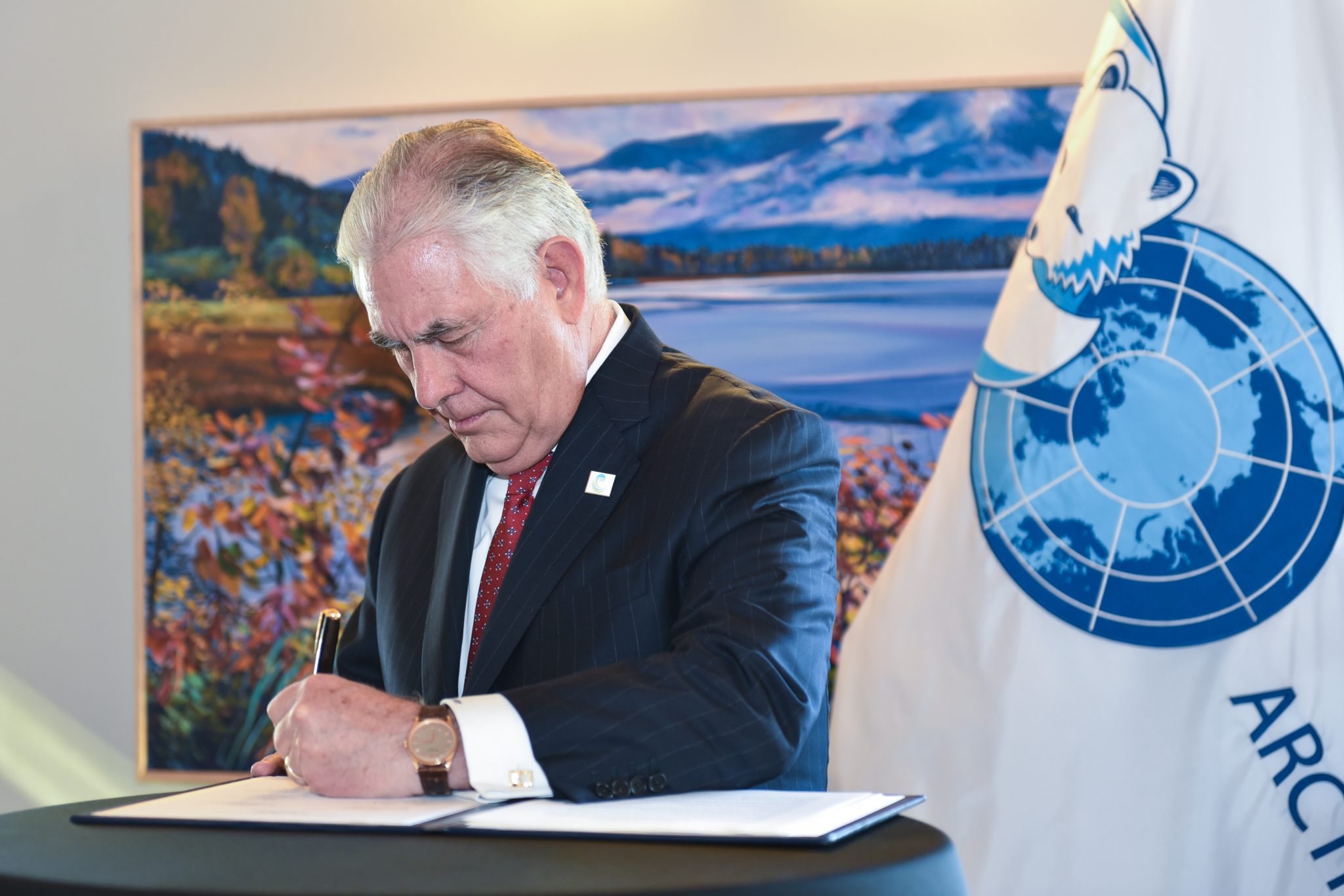 US President Donald Trump's first secretary of state, Rex Tillerson, signs an Arctic Council declaration that mentioned climate change nine times. Credit: Arctic Council Secretariat/Linnea Nordstrom. CC BY-ND 4.0.