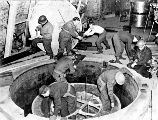 Allied soldiers in April 1945 dismantling the experimental nuclear pile at Haigerloch, where German scientists had tried to build a wartime reactor. Credit: Mickey Thurgood/US Army