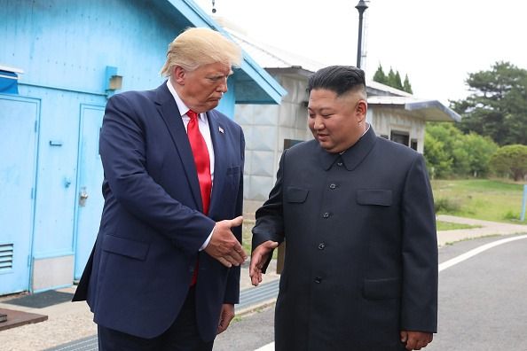 PANMUNJOM, SOUTH KOREA - JUNE 30: A handout photo provided by Dong-A Ilbo of North Korean leader Kim Jong Un and US President Donald Trump inside the demilitarized zone (DMZ) separating the South and North Korea in Panmunjom, South Korea. (Handout photo by Dong-A Ilbo via Getty Images/Getty Images)