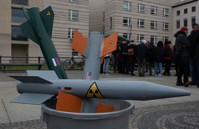 Rocket models are stuck in a bucket during a February protest action in Berlin against the imminent withdrawal of the INF disarmament agreement between Russia and the USA. Photo: Paul Zinken/dpa (Photo by Paul Zinken/picture alliance via Getty Images)