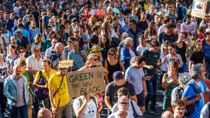 people on street marching with climate change signs