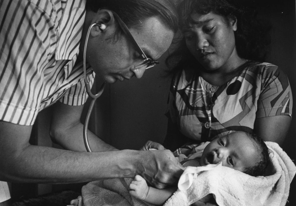 Doctor examining Marshallese infant
