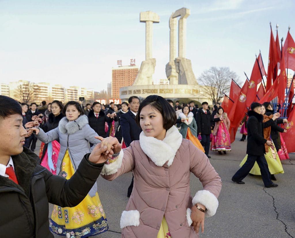 People dance in Pyongyang on Dec. 24, 2019, the birthday of North Korean leader Kim Jong Un's late grandmother, Kim Jong Suk. (Photo by Kyodo News via Getty Images)