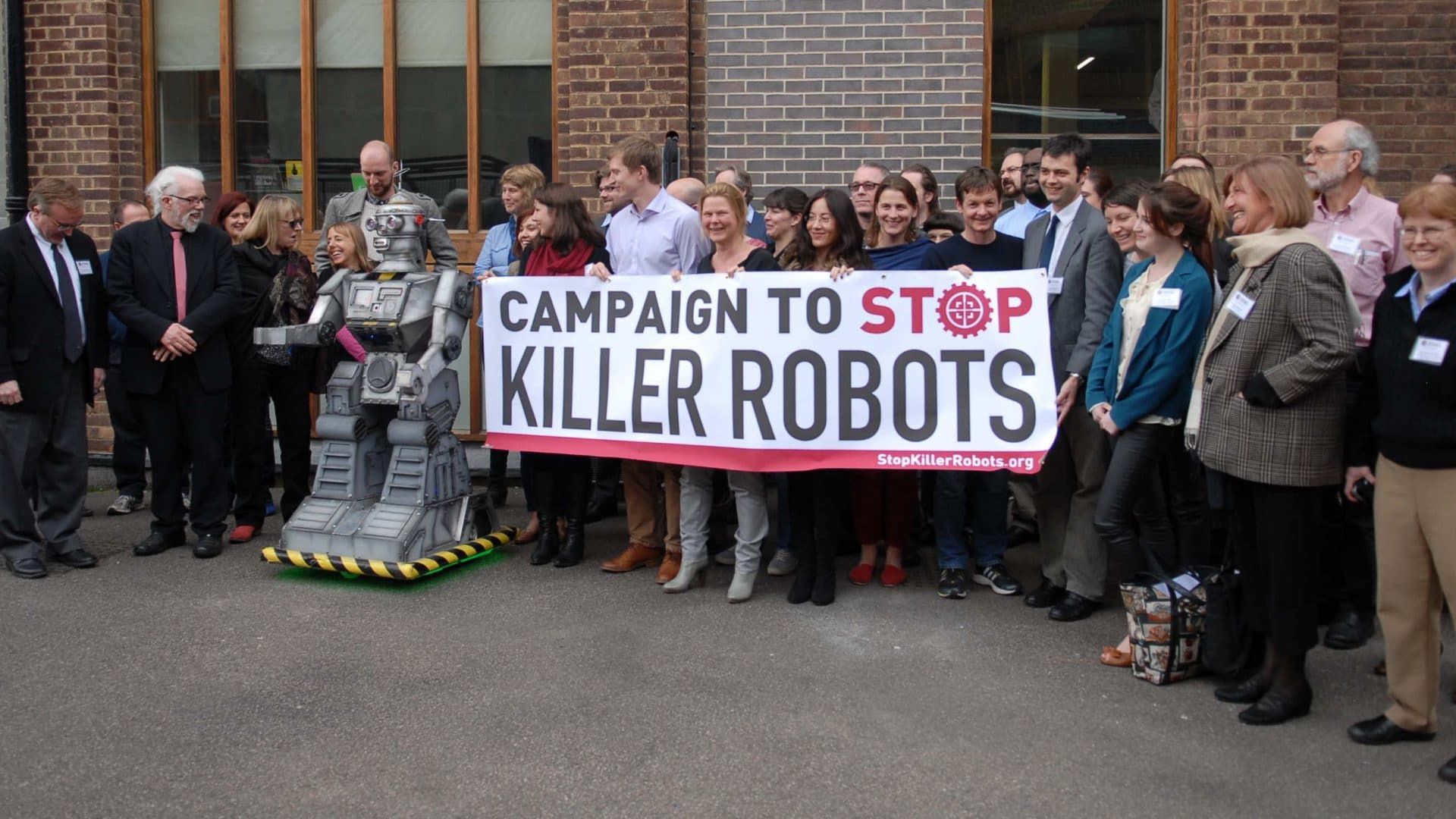 Activists hold a banner for the Campaign to Stop Killer Robots.
