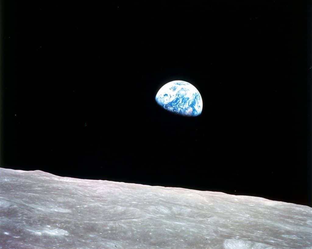 Earth rising above the moon