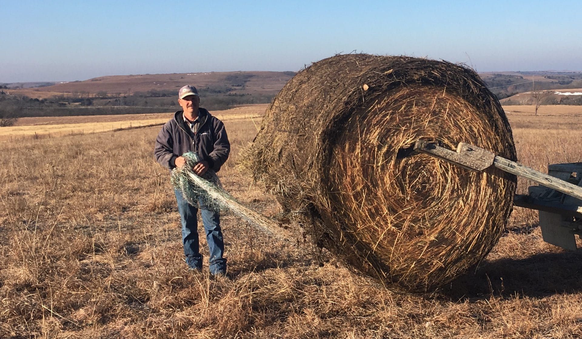 Matt Anderson prepares to feed cattle on his ranch in Alma, Kansas. Photo by Elisabeth Eaves