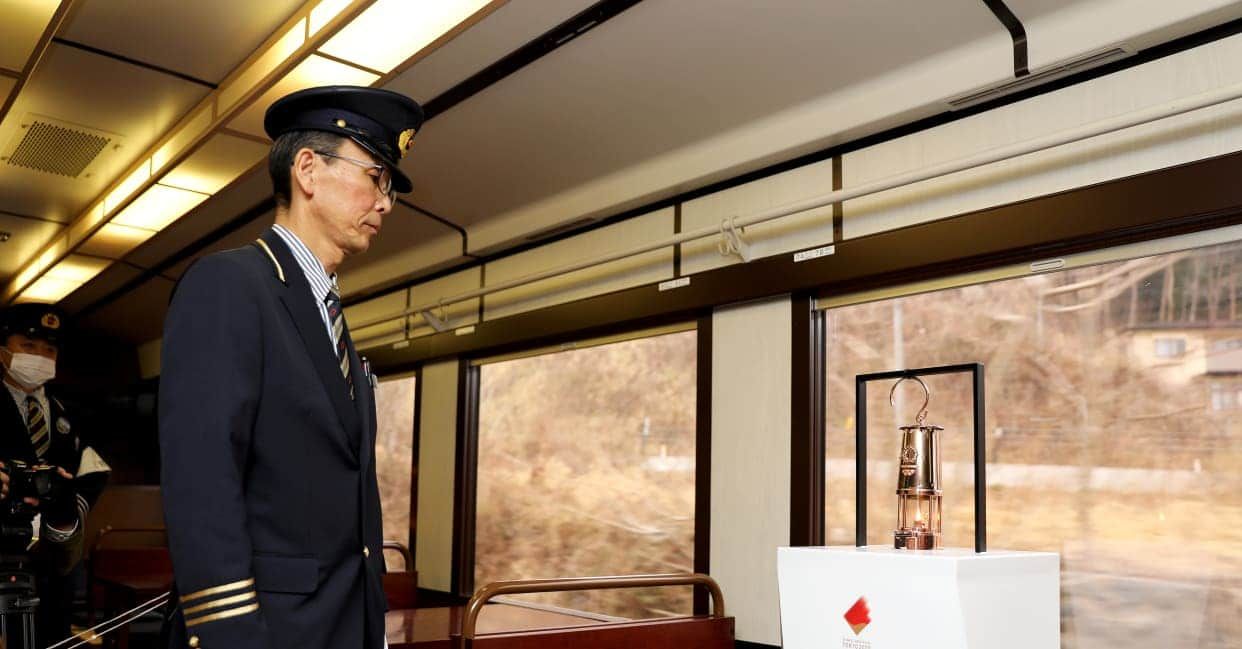 Olympic Torch Relay Lantern on its way to Fukushima aboard a train