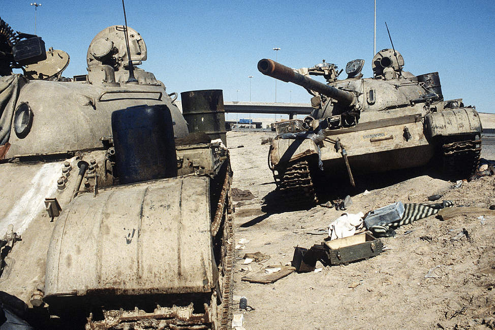 Two Iraqi T-54/55 tanks lie abandoned near Kuwait City on February 26, 1991. (Photo courtesy of PHC HOLMES, US Navy)