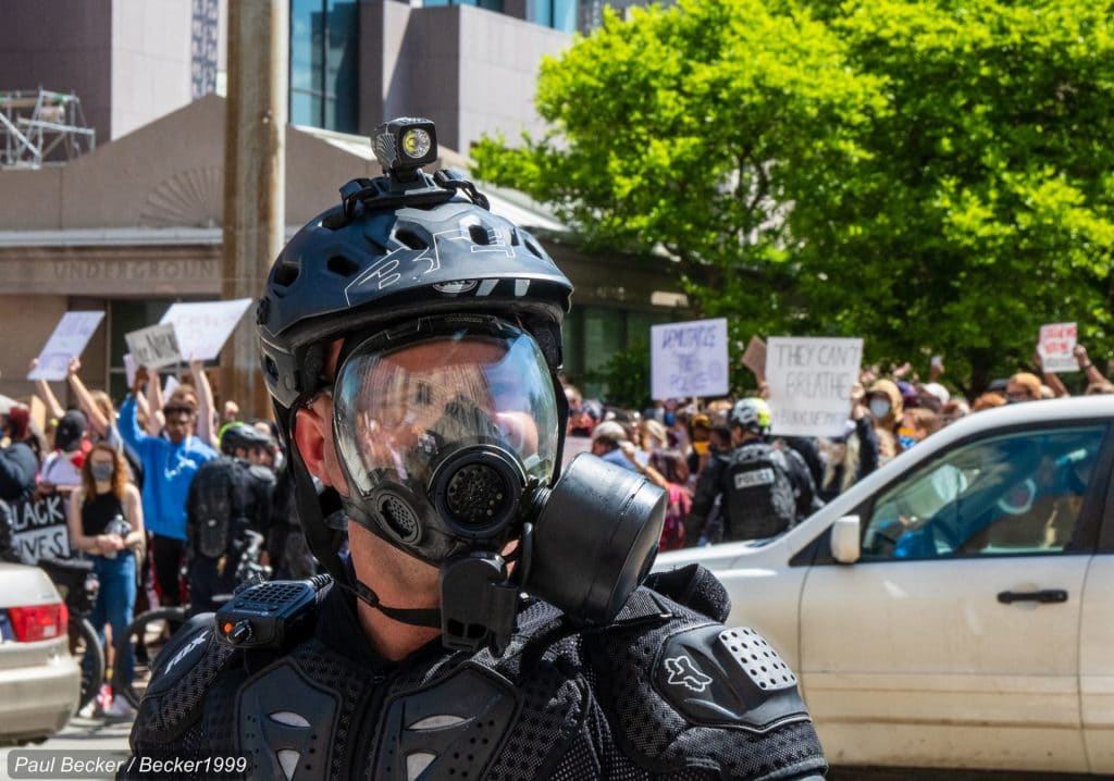 Police officer with a gas mask.