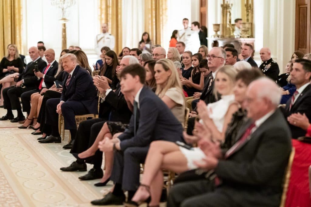 President Trump listens as songs are sung during a reception to honor Gold Star Families on September 27 in the East Room of the White House.