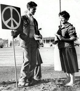 marcher with peace symbol in 1958
