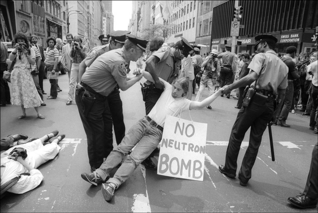 An anti-neutron bomb demonstrator is arrested for sitting in on 5th Ave, New York, New York, August 13, 1981. (Photo by Allan Tannenbaum/Getty Images)