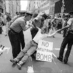 An anti-neutron bomb demonstrator is arrested for sitting in on 5th Ave, New York, New York, August 13, 1981. (Photo by Allan Tannenbaum/Getty Images)