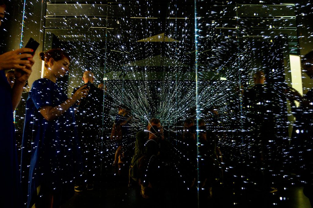 Visitors check out an infinity chamber at the "Futurium" in Berlin, a venue where significant national and international developments in scientific, technical and social research are to be presented and discussed among the government, the scientific community, industry, and society. (Photo credit: JOHN MACDOUGALL/AFP via Getty Images)