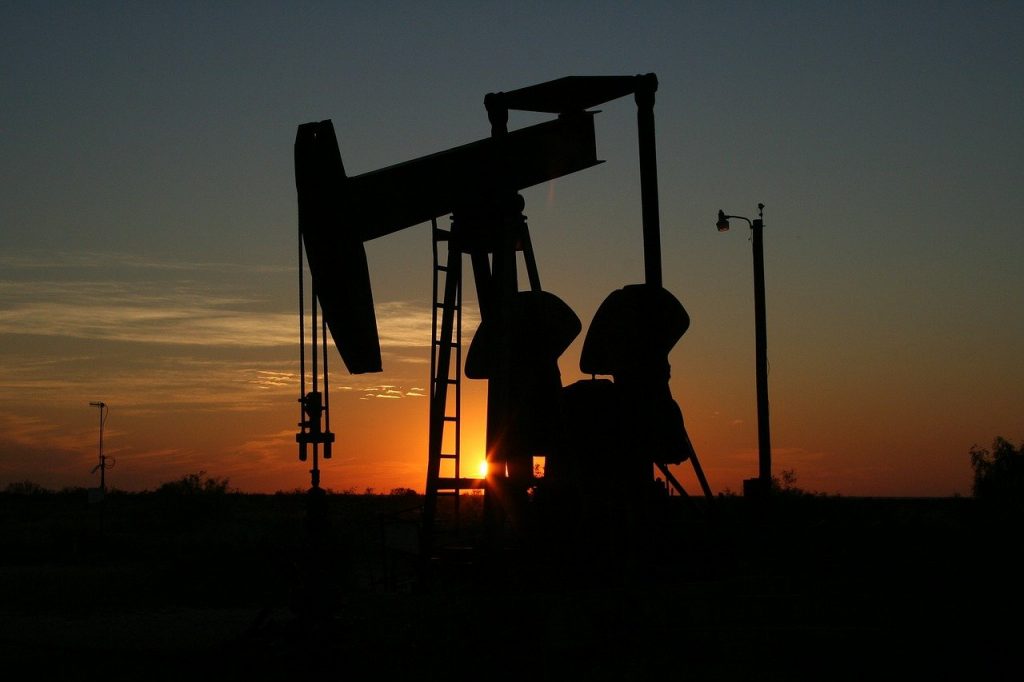 silhouette of oil grasshopper pump at sunset