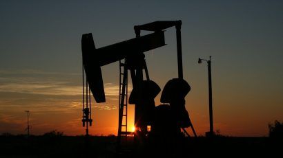 silhouette of oil grasshopper pump at sunset