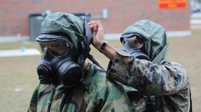 Soldiers practice responding to a chemical or biological weapons attack.