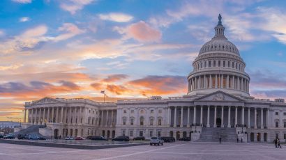 wide photo of US Capitol at sunset