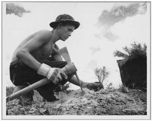 young man planting tree in 1930s