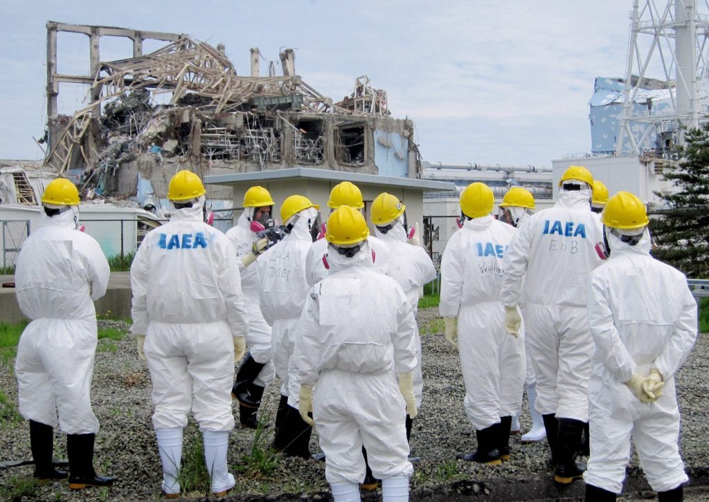 Experts from the International Atomic Energy Agency inspect the No. 3 reactor at the Fukushima Daiichi nuclear power plant in Fukushima Prefecture on May 27, 2011. (Photo by Kyodo News Stills via Getty Images)