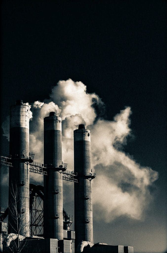 black and white photo of smokestacks