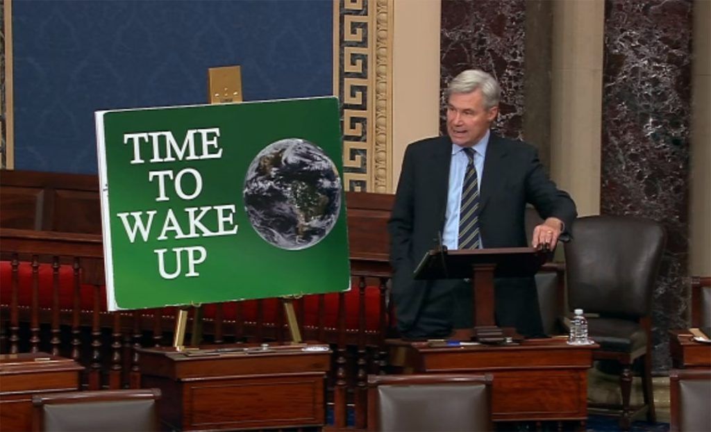 Sheldon Whitehouse and climate activism poster in US Senate