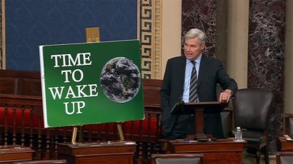 Sheldon Whitehouse and climate activism poster in US Senate