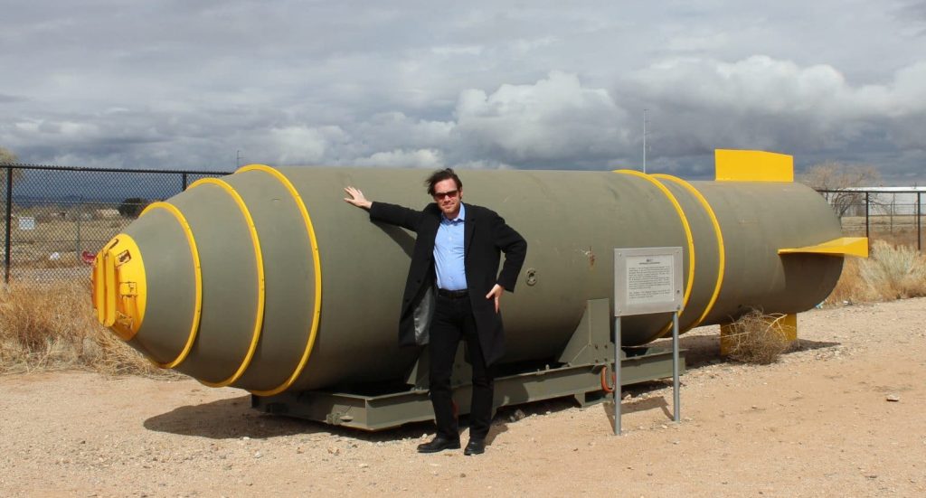 Alex Wellerstein leans against an Mk-17 hydrogen bomb casing at the National Museum of Nuclear Science and History in Albuquerque, New Mexico. Permission: Alex Wellerstein.