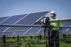 solar panels and technician