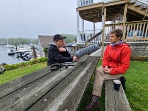 radio reporter interviewing Woods Hole physicist