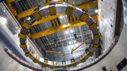magnet being lowered into place at ITER