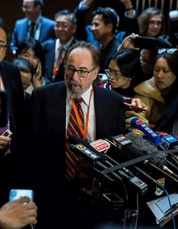 This picture, taken on November 27, 2018, shows biologist and summit chair David Baltimore (center right) of the California Institute of Technology speaking at a press conference during the Second International Summit on Human Genome Editing in Hong Kong. (Photo credit: Isaac Lawrence/AFP via Getty Images)