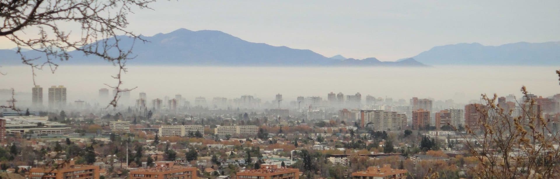 smog over city with mountains in background
