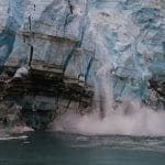 Part of a glaciar breaks off into the ocean