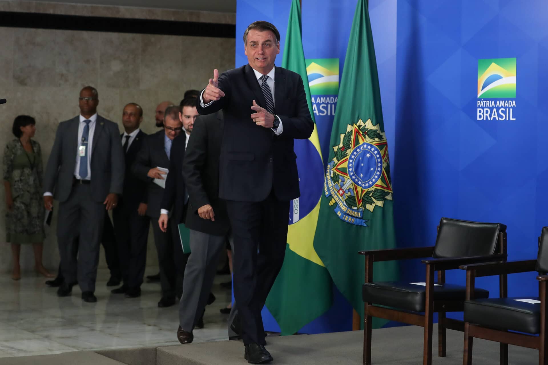 Brazil President Jair Bolsonaro making handgun gesture