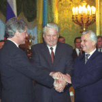 US President Bill Clinton, Russian President Boris, Yeltsin, and Ukrainian President Leonid Kravchuk sign the Trilateral Agreement on transferring nuclear weapons from Ukraine to Russia and associated matters in Moscow, January 1994. Photo credit: Joseph P. Harahan, historian of the Defense Threat Reduction Agency, and the Clinton Presidential Library.