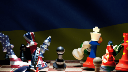 illustration of chess pieces made of flags of the nine nuclear weapons states falling over with Ukrainian flag in the background