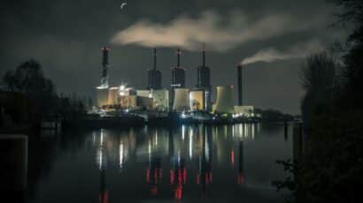 power plant reflected in water at night
