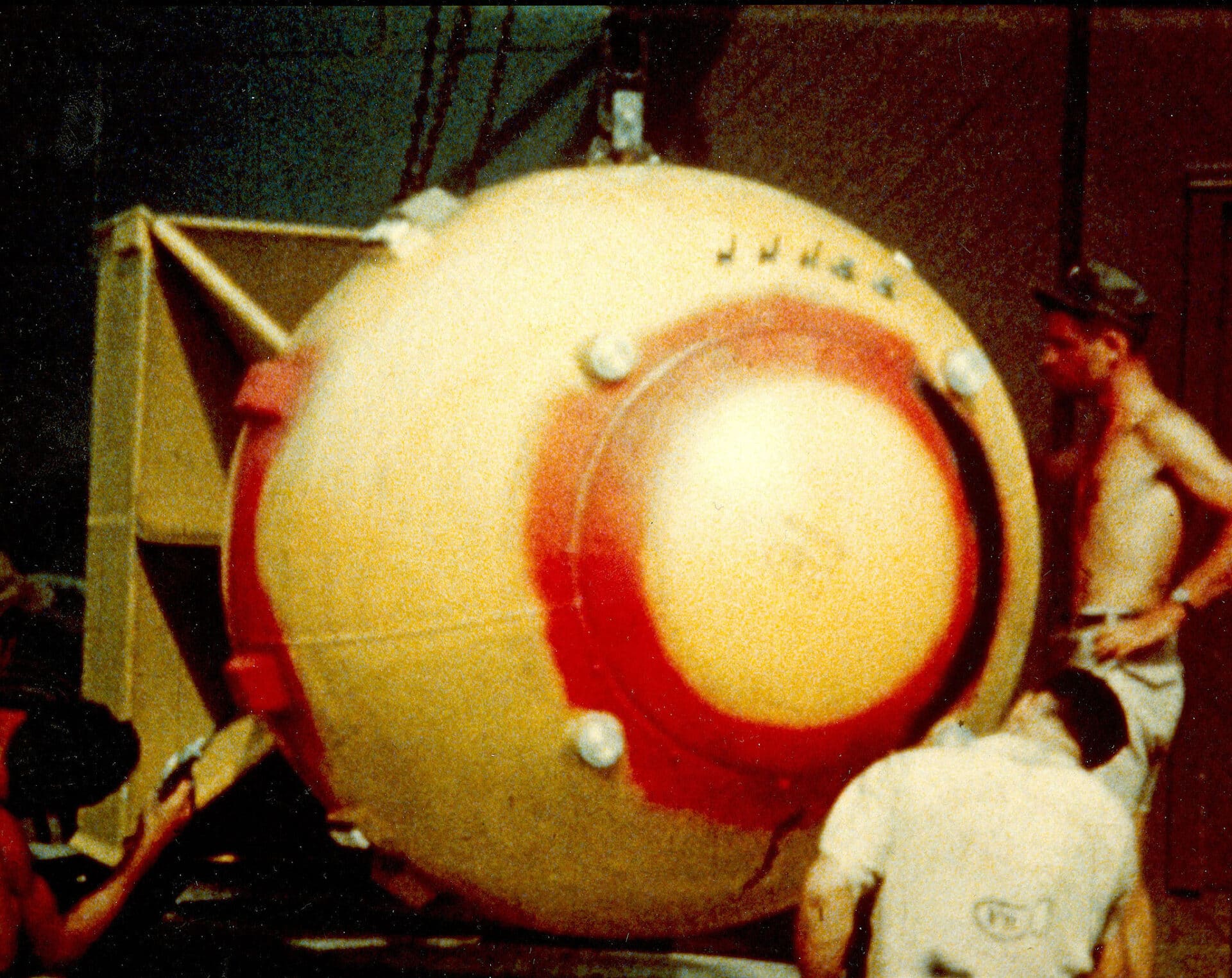 Assembling the components of the Fat Man atomic bomb on the South Pacific island of Tinian. Photo courtesy of Los Alamos National Laboratory.
