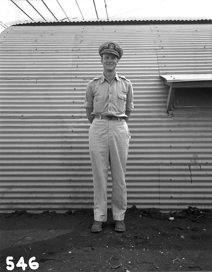The person in charge of assembling the bomb, and overseeing it while on board the plane—Bockscar—that dropped the weapon was Commander Frederick L. Ashworth, seen here in front of a Quonset hunt on Tinian. Ashworth was a Navy man, while the plane’s pilot, Charles W. Sweeney, was with the Army—which added to the confusion of just who was in charge while they were in flight and waiting at their rendezvous point for their two accompanying planes. When the photo plane never showed up, Ashworth wanted Bockscar to proceed directly to the target anyway, while Sweeney wanted to wait. Bockscar waited 45 minutes, during which it consumed precious fuel; the photo plane never did show up. So much fuel was wasted that the plane barely had enough to drop the bomb and land at the nearest base afterward. (In fact, at one point it looked like Bockscar would crash into the ocean well before getting to the runway. One crewmember remembers wondering how cold the Pacific would be when they ditched.)
Photo courtesy of Los Alamos National Laboratory.