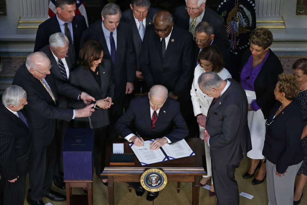 President Joe Biden is joined by Vice President Kamala Harris, Office of Management and Budget acting Director Shalanda Young and congressional leaders as he signs the “Consolidated Appropriations Act" on March 15, 2022. The act will fund the federal government through September 2022 and provide more than $780 billion for the US military. (Photo by Chip Somodevilla/Getty Images)