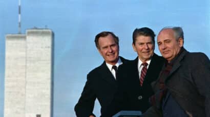 After a meeting in New York, President Ronald Reagan, Vice President George Herbert Walker Bush and Soviet General Secretary Mikhail Gorbachev pose with the World Trade Center in the background.