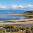 great salt lake, exposed shoreline in foreground, mountains in background