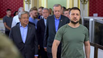 UN Secretary General and presidents of Ukraine and Turkey walking together at summit meeting